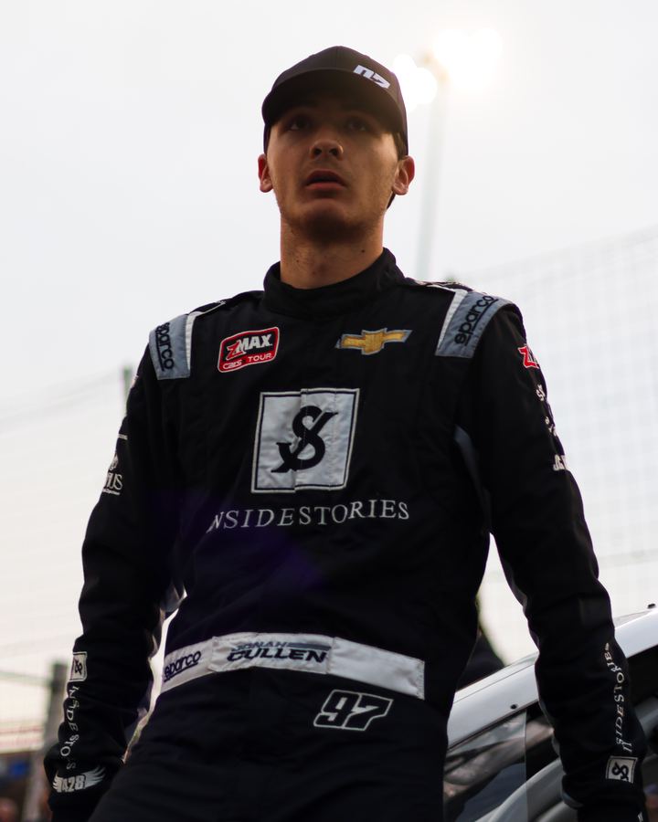 Jonah in his firesuit under the lights at Hickory