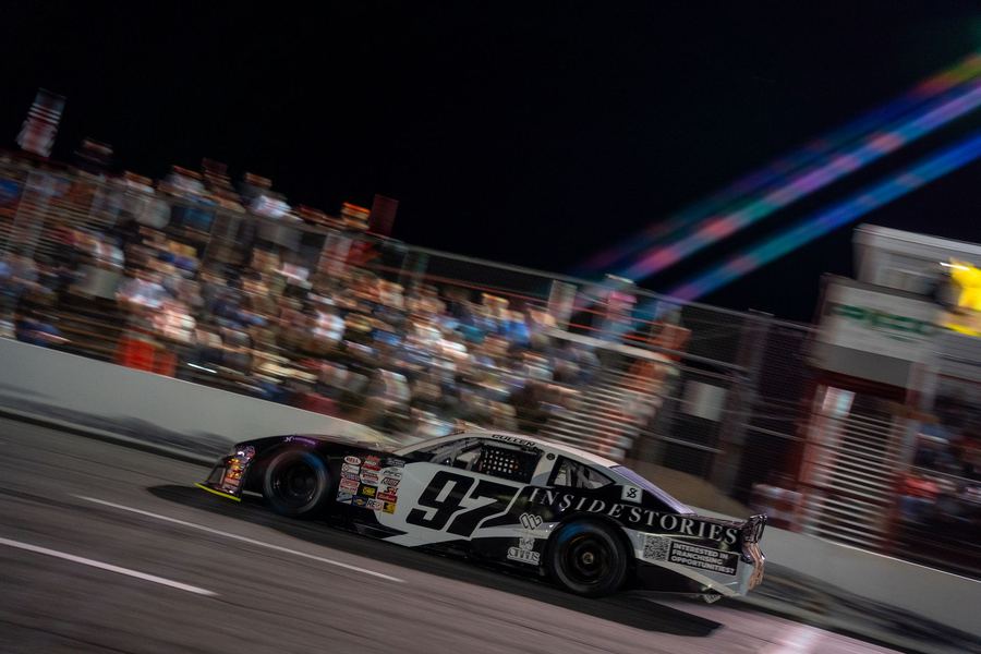 The #97 at night with the crowd behind